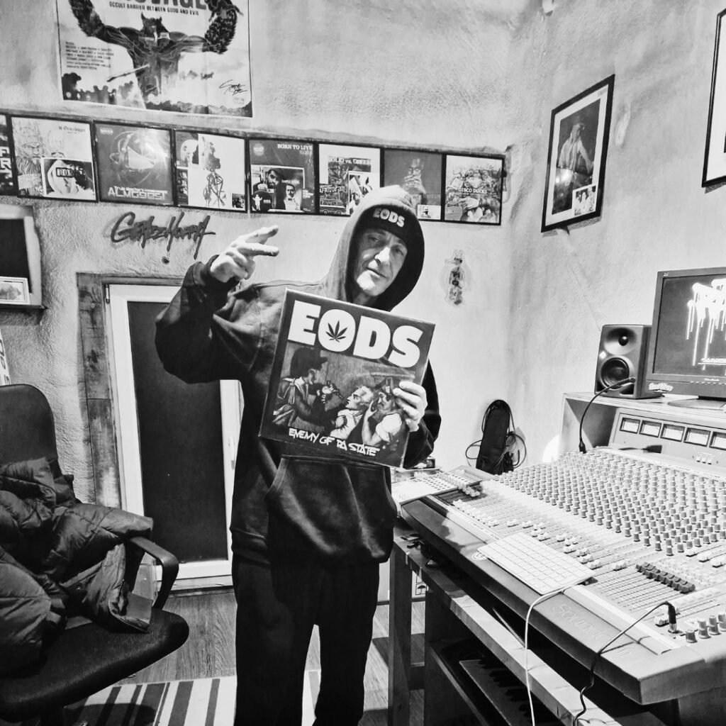 DJ GRAZZHOPPA holding his album E.O.D.S.