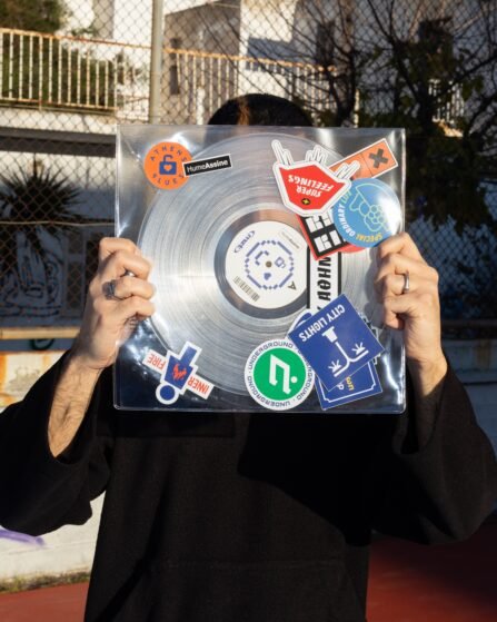 Man holds a vinyl in PVC sleeve