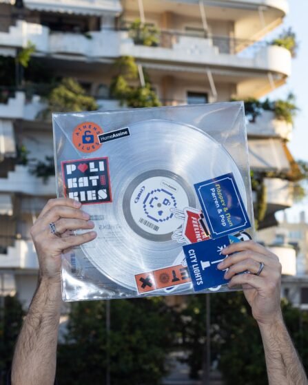 Hands holding up a vinyl record