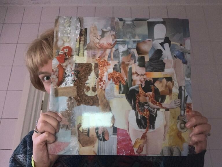 Girl holds a vinyl record in front of her face