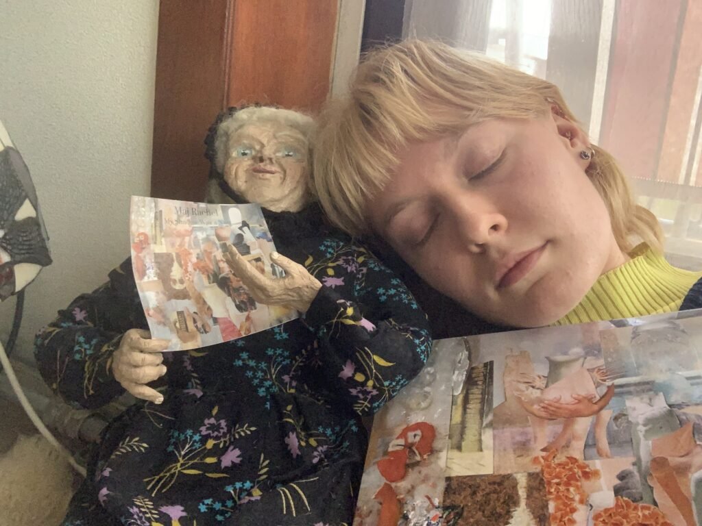 Girl holds a vinyl and slips her head on a nun doll
