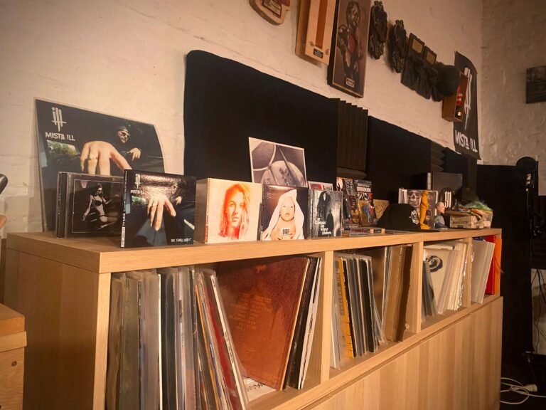 vinyl records and CDs on a furniture