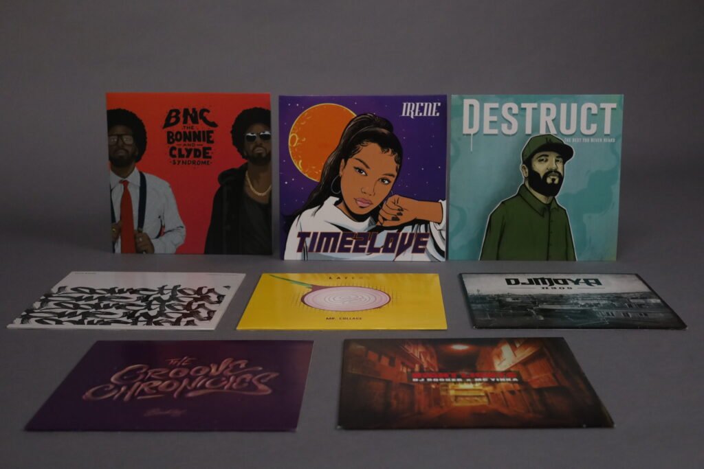 Nine Mind The Wax vinyl releases by BNC, Irene, Destruct, Billa Qause, Mr. Collage, DJ Moya, Booklas, DJ Booker and MC Yinka displayed together.
